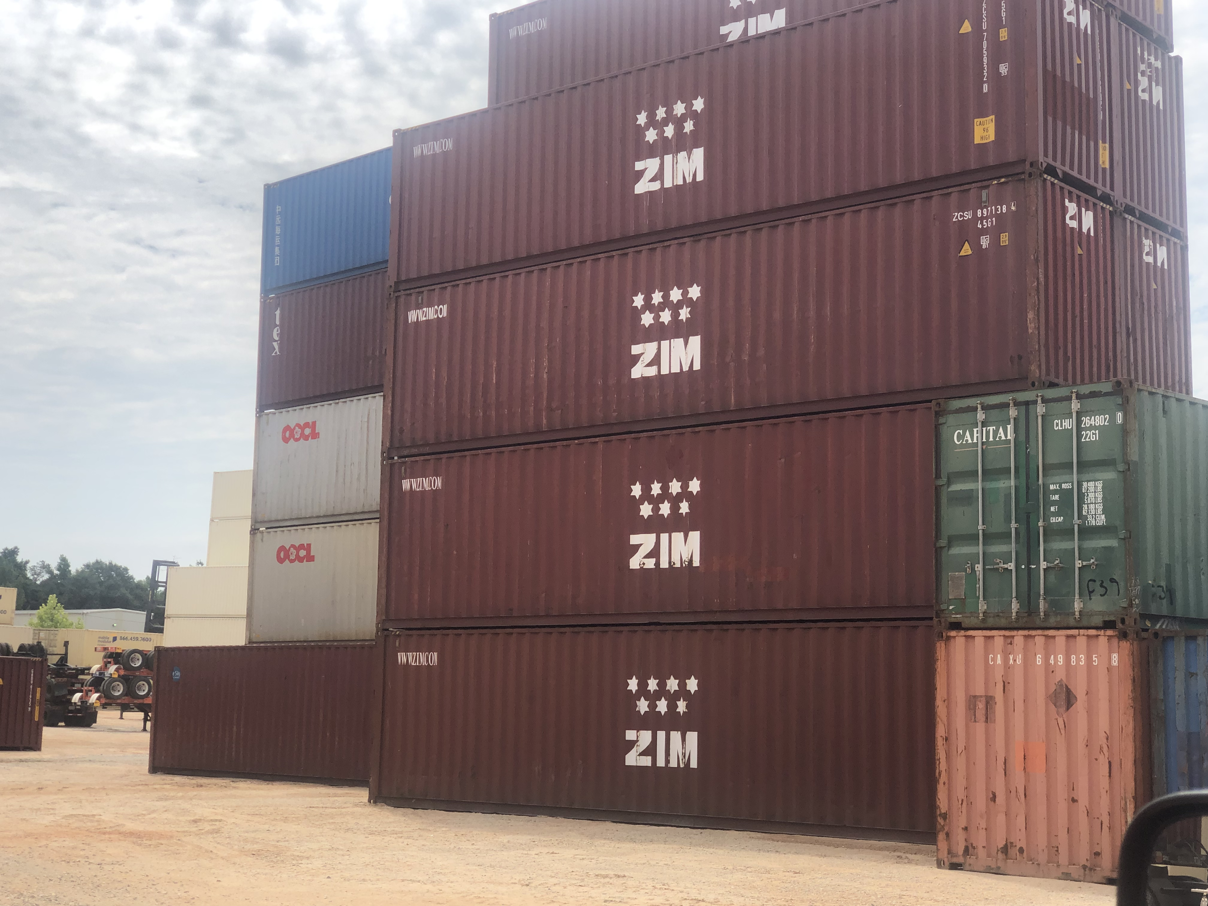 Shipping containers staged in a sales yard