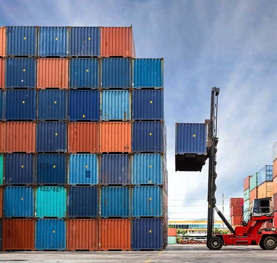 Shipping containers being loaded at a depot